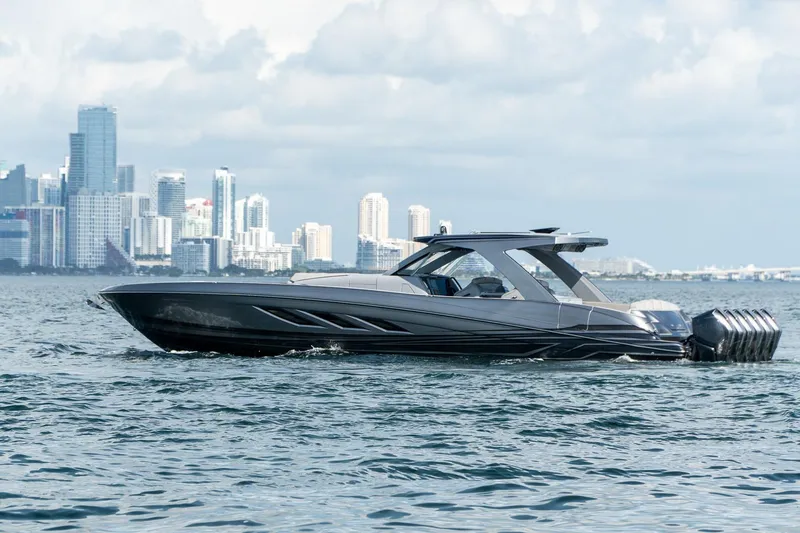 Slide: The Image of 2026 Deep Impact 499 Sport boat cruising near city skyline. - 19