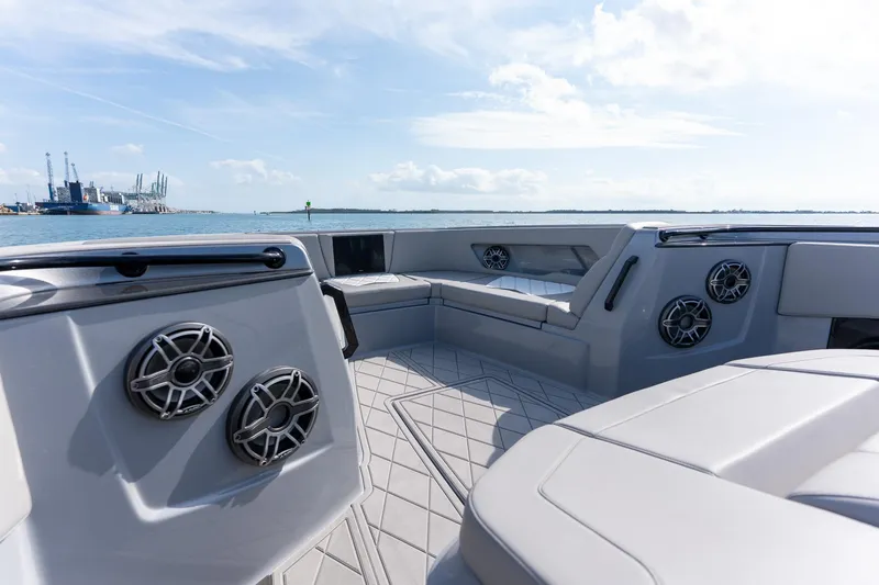 Slide: The Image of Luxurious 2026 Deep Impact 499 Sport boat interior with sleek seating and modern speakers. - 29