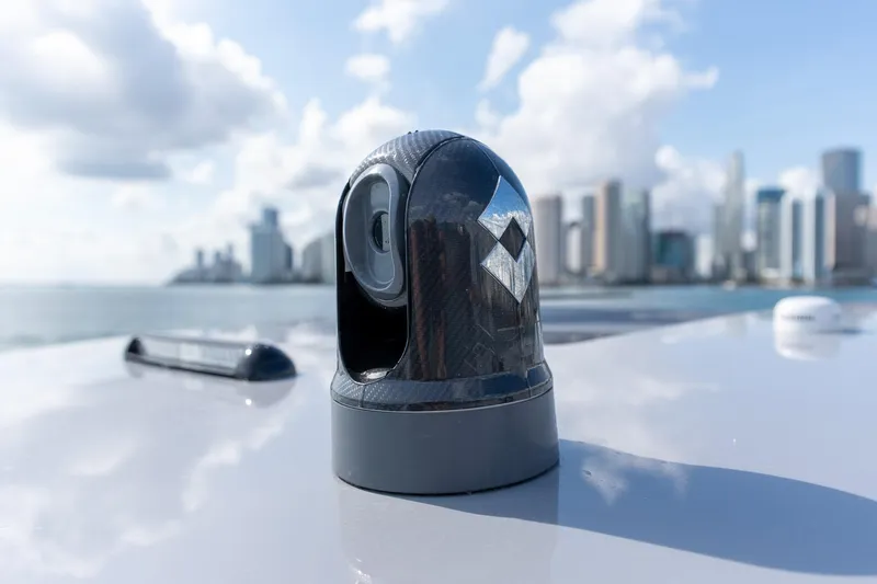 Slide: The Image of Rooftop camera on 2026 Deep Impact 499 Sport boat with city skyline background. - 31