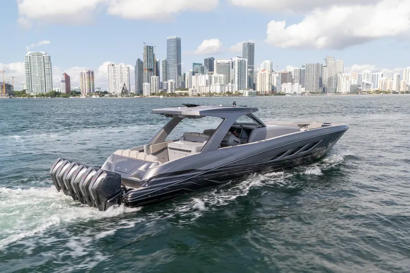 Slide: The Image of Luxury 2026 Deep Impact 499 Sport boat cruising near city skyline. - 5