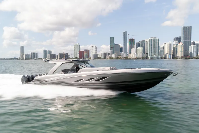 Slide: The Image of 2026 Deep Impact 499 Sport boat cruising near city skyline on a sunny day. - 8