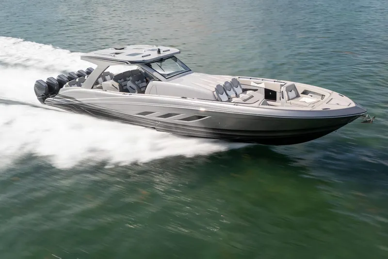 Slide: The Image of 2026 Deep Impact 499 Sport boat speeding on water, showcasing sleek design and powerful engines. - 9