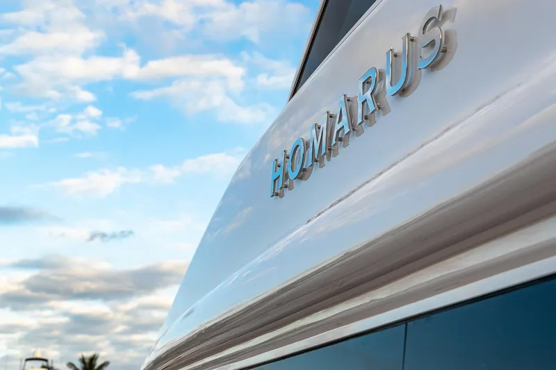 The Image of 2021 Horizon PC60 yacht with "HOMARUS" nameplate against a cloudy sky. - 0