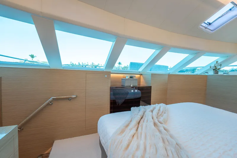 Slide: The Image of Luxurious yacht bedroom with large windows, modern decor, and cozy bedding, Horizon 2021 model. - 15