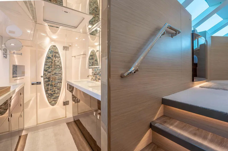 Slide: The Image of Luxurious yacht bathroom with modern design, glass shower, and elegant wood accents, Horizon 2021. - 17