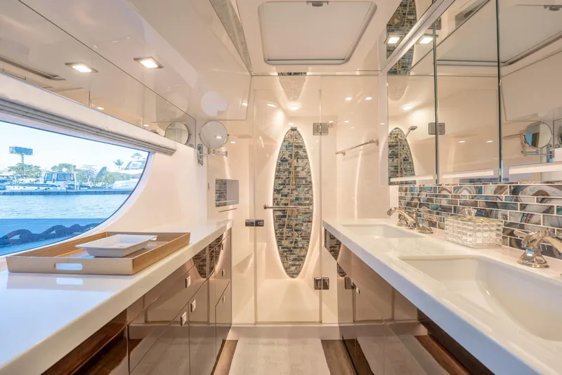 Slide: The Image of Luxurious yacht bathroom with modern fixtures, large mirrors, and scenic window view, Horizon 2021. - 18