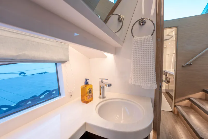 Slide: The Image of Modern yacht bathroom with sink, towel, and window view, Horizon 2021 model. - 24