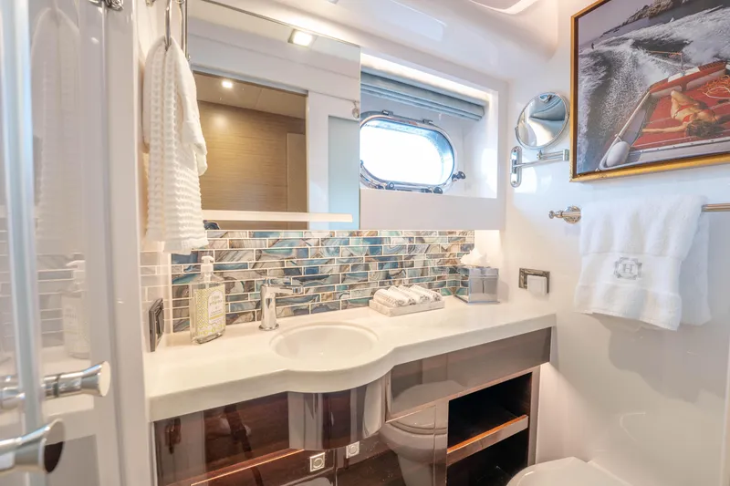 Slide: The Image of Luxurious yacht bathroom with modern fixtures, mosaic backsplash, and nautical-themed decor, Horizon 2021. - 27