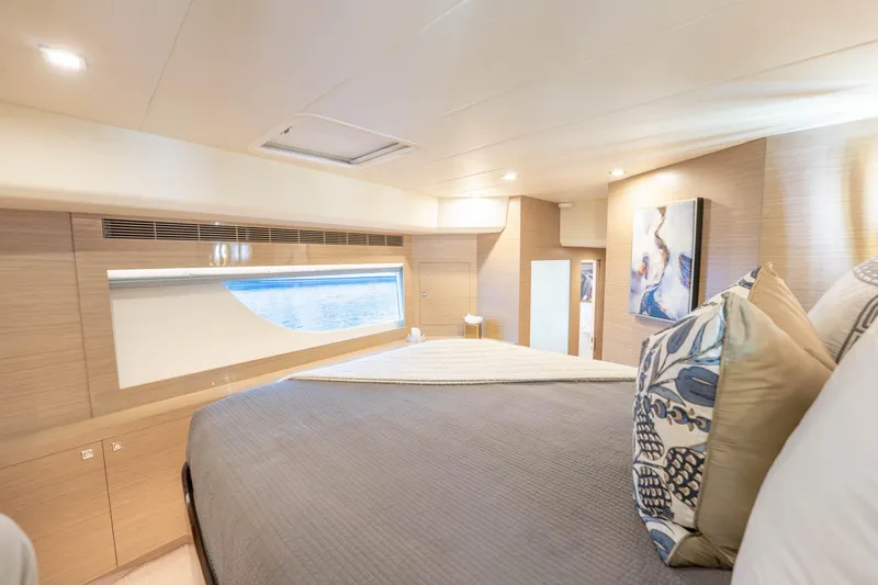 Slide: The Image of Luxurious 2021 Horizon yacht bedroom with elegant decor and ocean view window. - 34