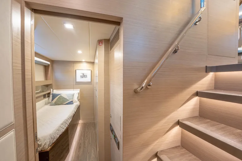Slide: The Image of Luxurious Horizon yacht interior with cozy bedroom and elegant staircase, 2021 model. - 35