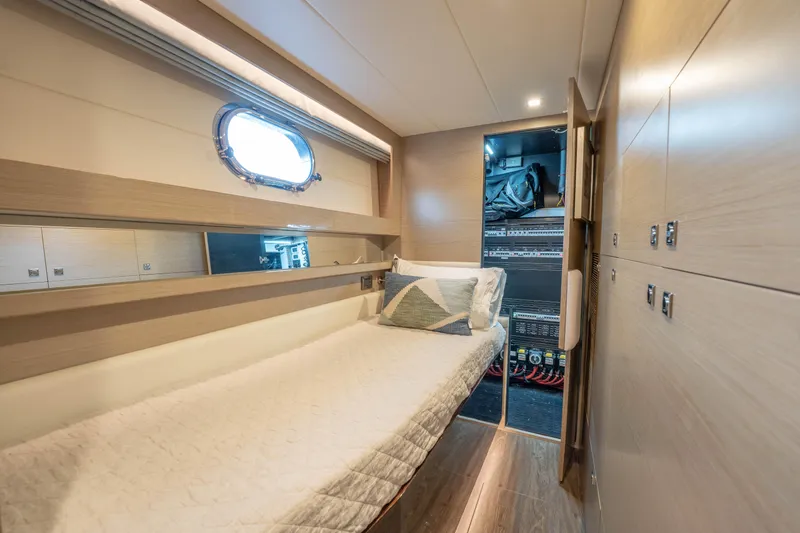 Slide: The Image of Luxurious 2021 Horizon yacht cabin with single bed and modern decor. - 37