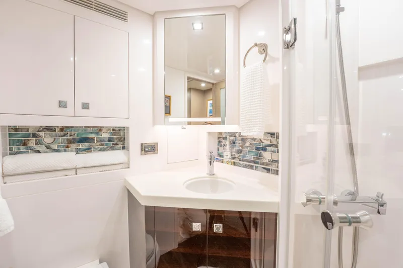 Slide: The Image of Modern yacht bathroom with sleek fixtures, mosaic backsplash, and elegant lighting, Horizon 2021. - 42