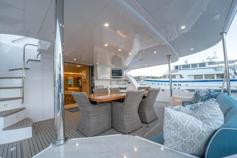 Slide: The Image of Luxurious Horizon yacht deck with dining area and seating, 2021 model. - 46
