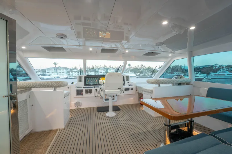 Slide: The Image of Luxurious 2021 Horizon yacht interior with modern helm, seating, and panoramic windows. - 51