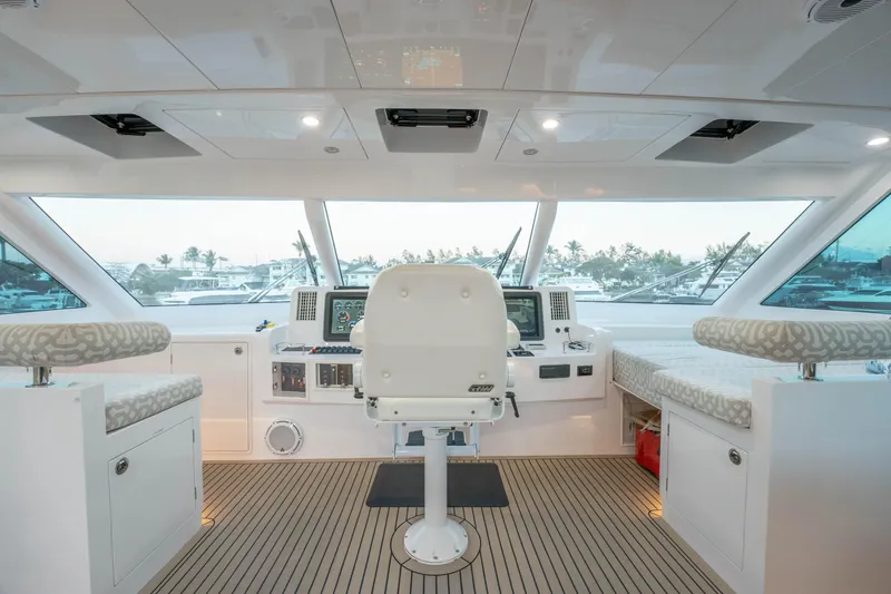 Slide: The Image of Luxurious 2021 Horizon yacht helm with modern controls and panoramic windows. - 52