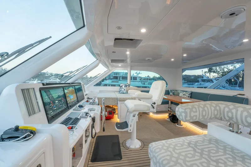Slide: The Image of Luxurious 2021 Horizon yacht interior with modern helm, plush seating, and panoramic windows. - 56