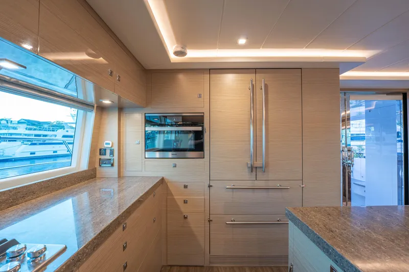 Slide: The Image of Luxurious yacht kitchen interior with modern appliances and sleek wooden cabinetry, Horizon 2021. - 6