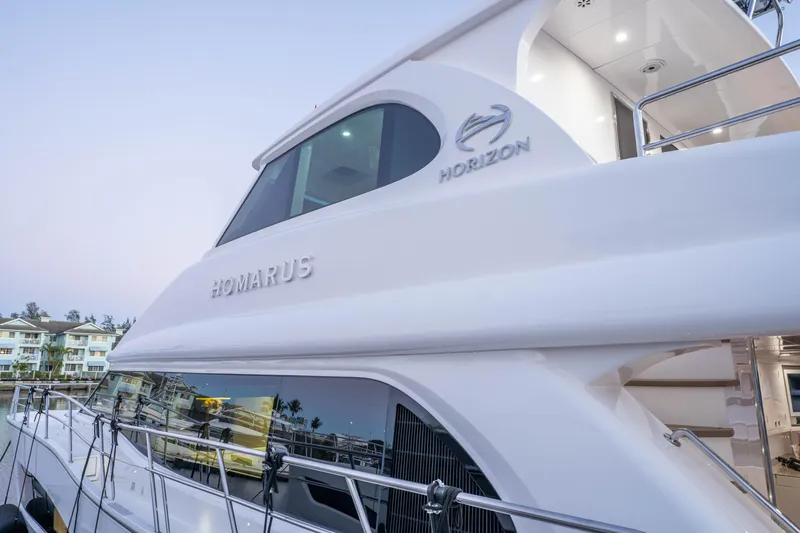 Slide: The Image of Luxury Horizon yacht "Homarus" docked, showcasing sleek design and modern architecture, 2021 model. - 65