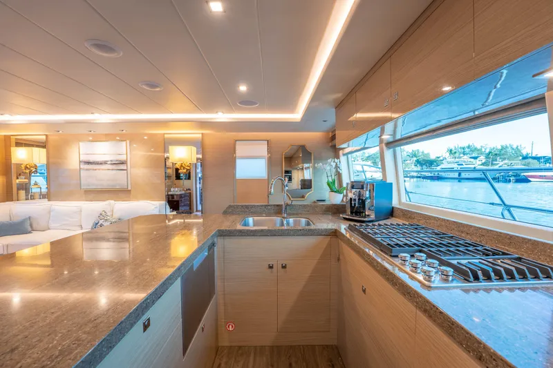 Slide: The Image of Luxurious Horizon yacht kitchen interior with modern appliances and waterfront view, 2021 model. - 7