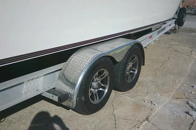Slide: The Image of Trailer for 1996 Fountain 31 Center Console boat on concrete surface. - 10