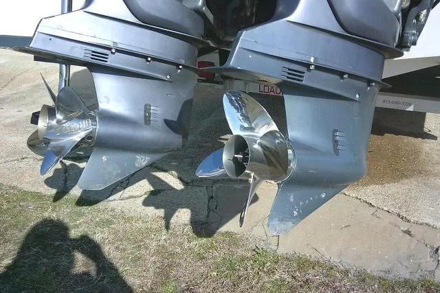 Slide: The Image of Twin outboard motors on a 1996 Fountain 31 Center Console boat. - 13