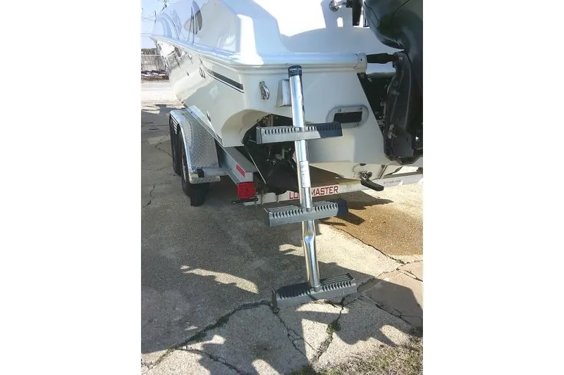 Slide: The Image of 1996 Fountain 31 Center Console boat with trailer and ladder, rear view. - 15