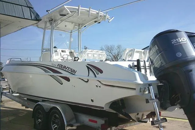 Slide: The Image of 1996 Fountain 31 Center Console boat on trailer with Yamaha 250 outboard motor. - 16