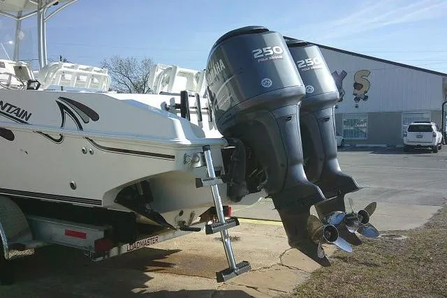 Slide: The Image of 1996 Fountain 31 Center Console boat with twin Yamaha 250 outboard engines. - 17