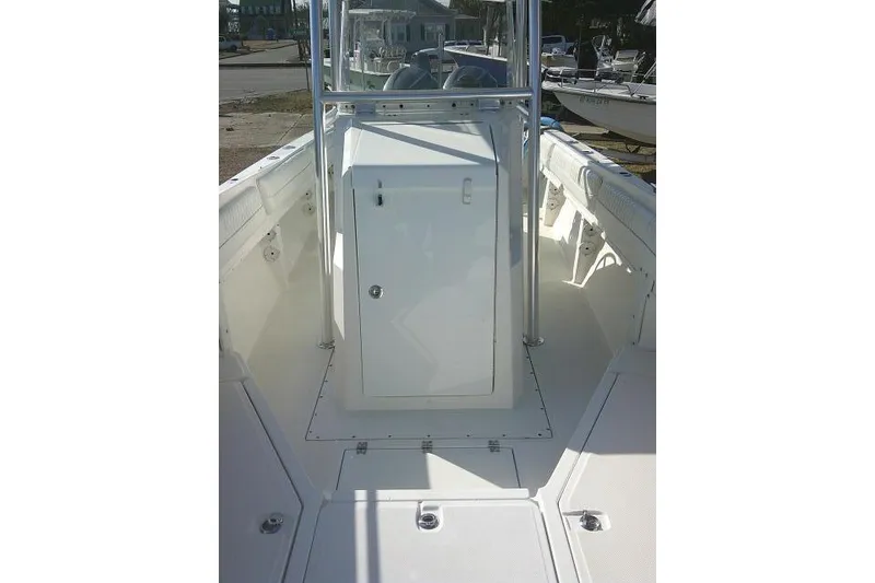 Slide: The Image of 1996 Fountain 31 Center Console boat interior with white deck and console. - 25