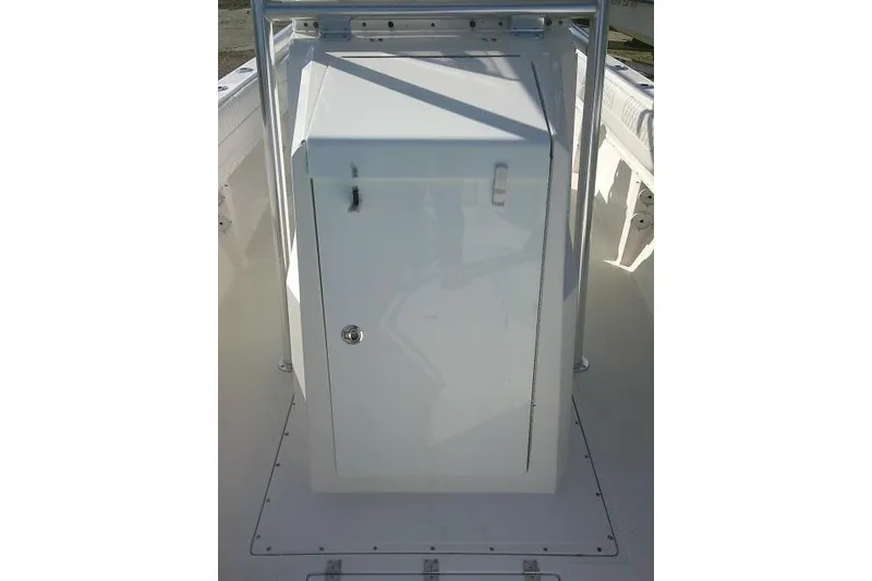 Slide: The Image of 1996 Fountain 31 Center Console boat, featuring a white storage compartment. - 28
