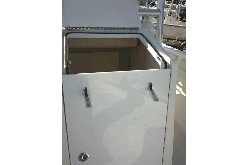 Slide: The Image of 1996 Fountain 31 Center Console boat with open storage compartment. - 30