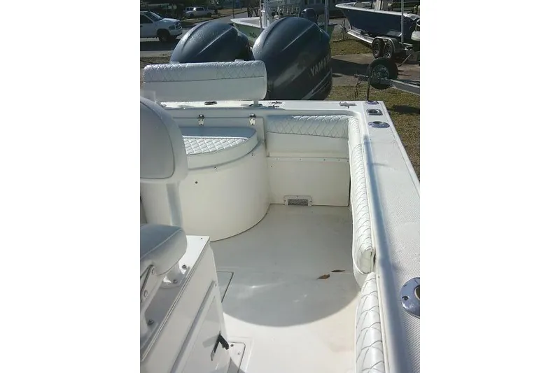 Slide: The Image of 1996 Fountain 31 Center Console boat interior with seating and dual Yamaha engines. - 34