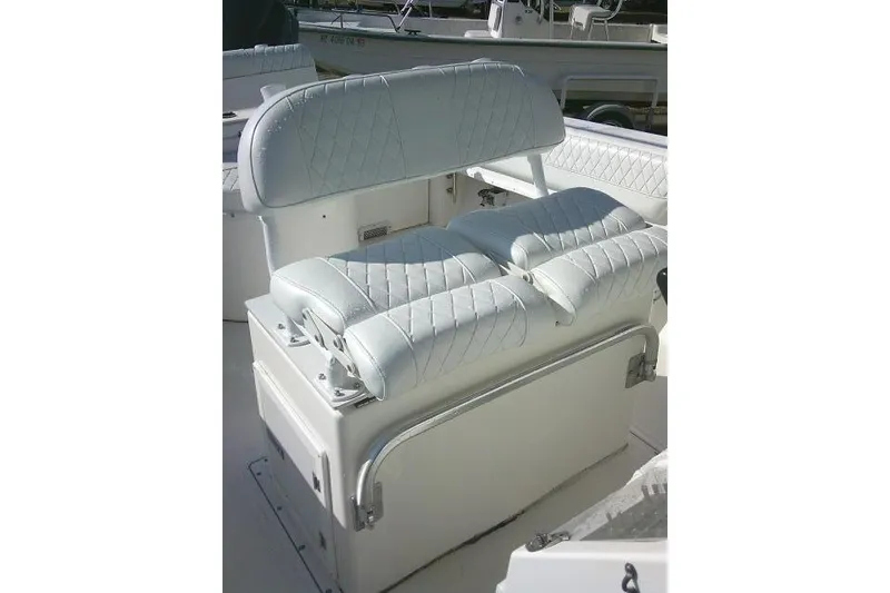 Slide: The Image of 1996 Fountain 31 Center Console boat seating with white quilted upholstery. - 35