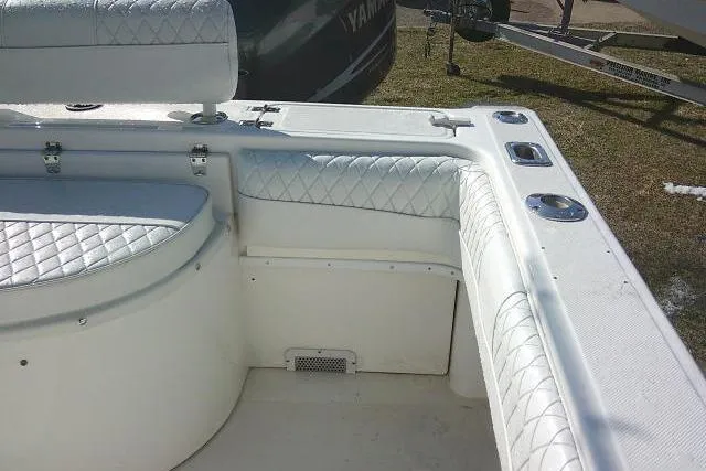 Slide: The Image of 1996 Fountain 31 Center Console boat interior with white quilted seating. - 39