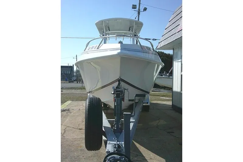 Slide: The Image of 1996 Fountain 31 Center Console boat on trailer, front view. - 4