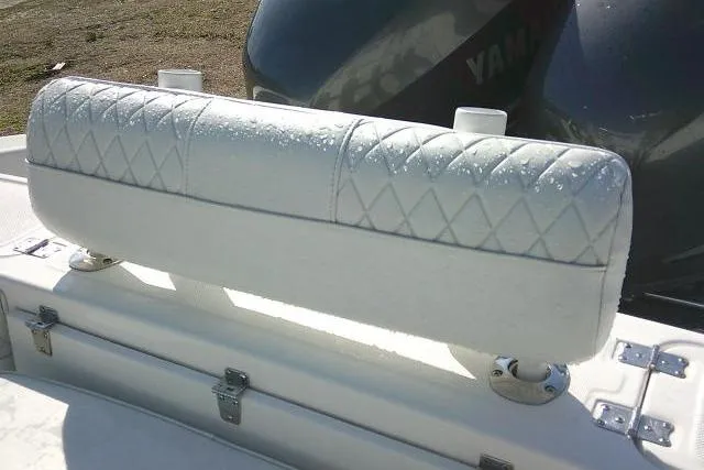Slide: The Image of 1996 Fountain 31 Center Console boat seat with diamond-patterned upholstery. - 41