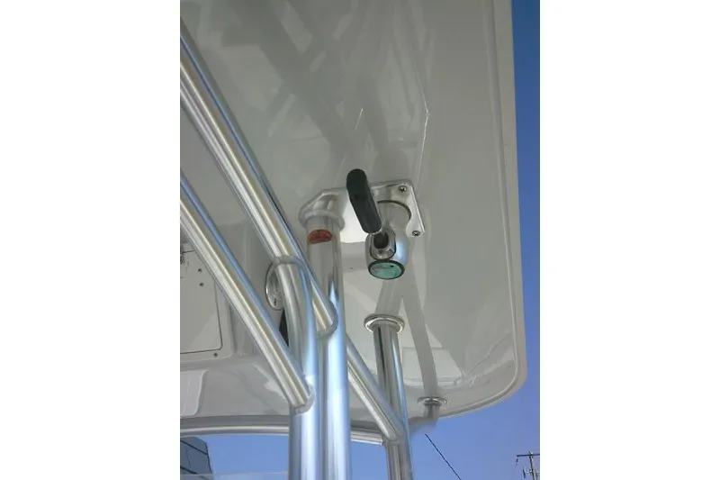Slide: The Image of Close-up of a 1996 Fountain 31 Center Console boat's metal railing and hardware. - 46