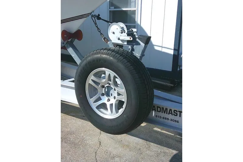 Slide: The Image of Trailer wheel of a 1996 Fountain 31 Center Console boat. - 5