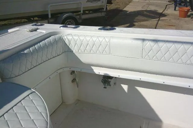 Slide: The Image of 1996 Fountain 31 Center Console boat interior with quilted white seating. - 51
