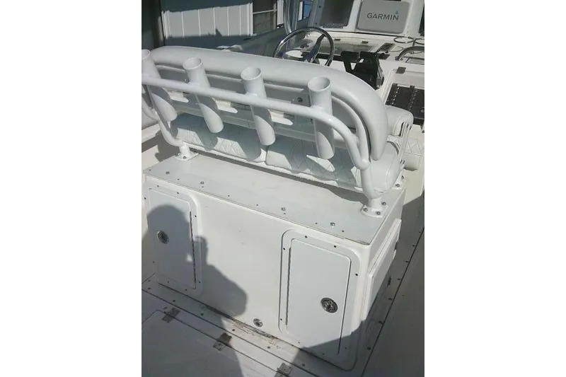 Slide: The Image of 1996 Fountain 31 Center Console boat interior with rod holders and Garmin equipment. - 53
