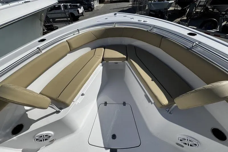 Slide: The Image of 2026 Sportsman Open 252 Center Console boat with tan seating and spacious deck. - 10