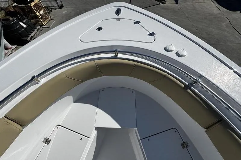 Slide: The Image of 2026 Sportsman Open 252 Center Console boat, featuring spacious bow seating and storage compartments. - 5