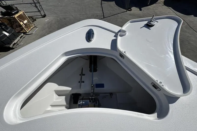 Slide: The Image of Open anchor compartment on 2026 Sportsman Open 252 Center Console boat. - 6
