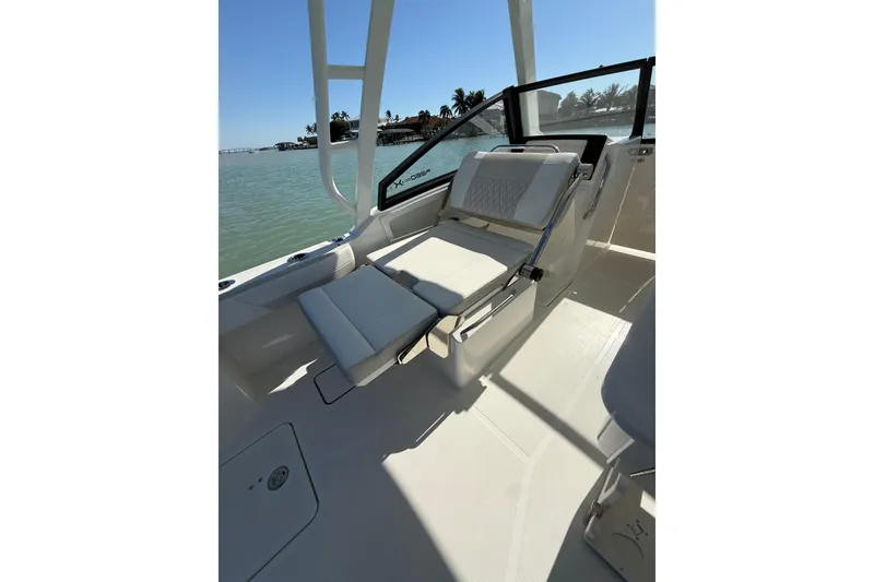 Slide: The Image of 2025 World Cat 260 DC-X boat interior with comfortable seating and ocean view. - 17