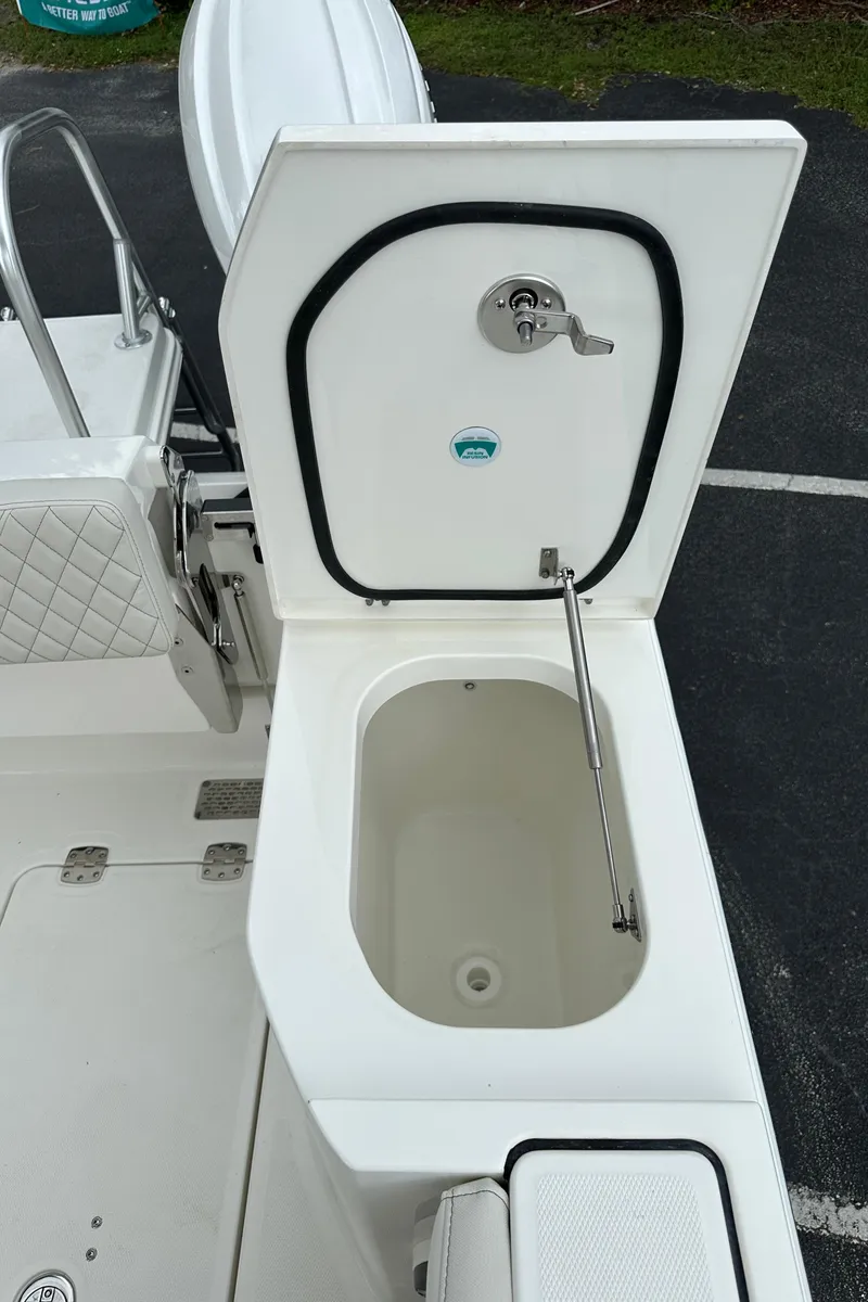 Slide: The Image of 2025 World Cat 260 DC-X boat storage compartment with open lid. - 19