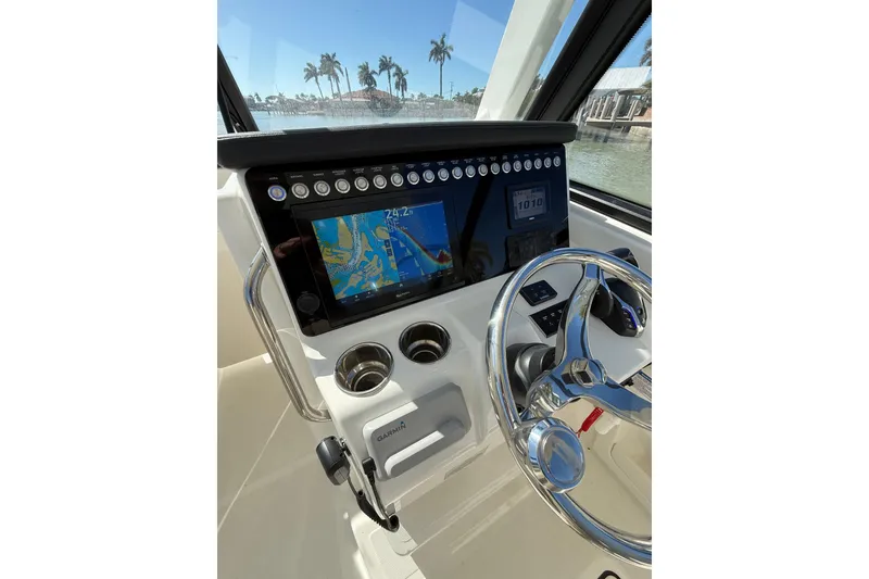 Slide: The Image of Helm of 2025 World Cat 260 DC-X with navigation display and steering wheel. - 4