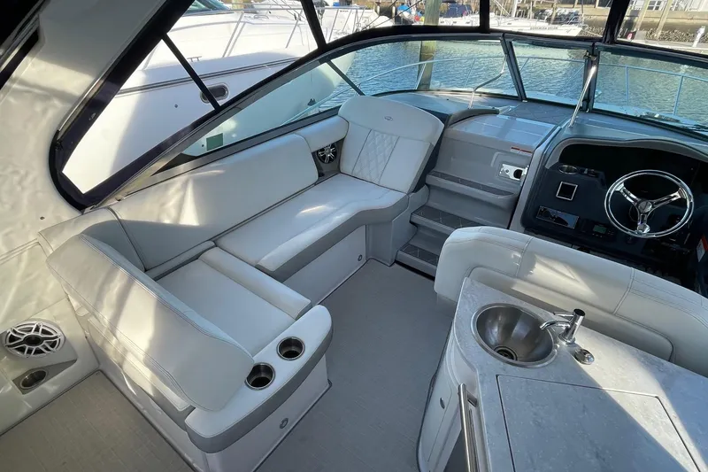 Slide: The Image of Luxurious interior of 2021 Regal 33 XO boat with seating and helm. - 15
