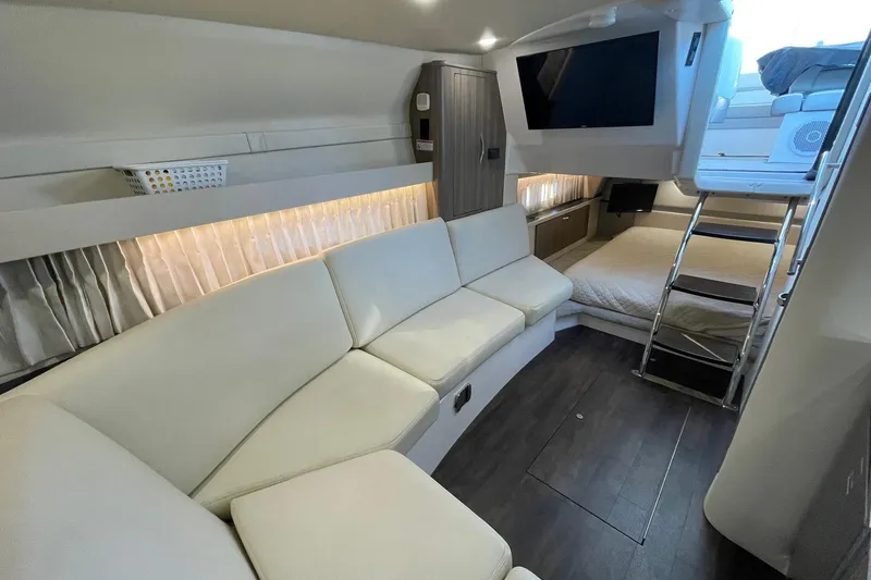 Slide: The Image of Luxurious interior of 2021 Regal 33 XO yacht with modern seating and entertainment area. - 19