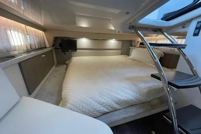 Slide: The Image of Luxurious interior of 2021 Regal 33 XO yacht with cozy bed and modern amenities. - 20