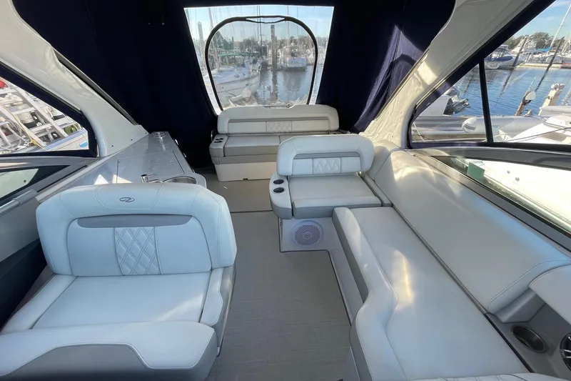 Slide: The Image of Luxurious interior of a 2021 Regal 33 XO yacht with elegant seating and marina view. - 8